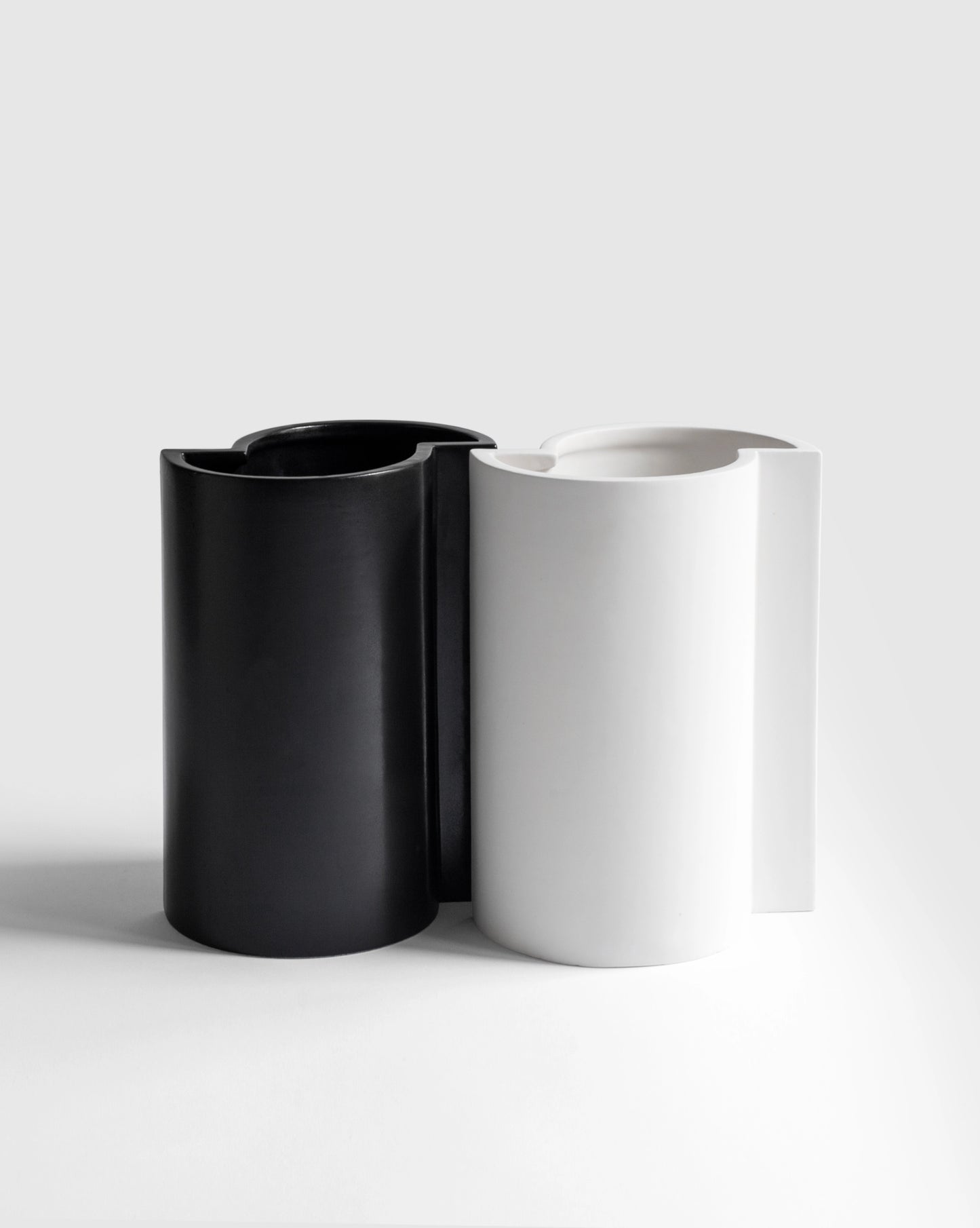 Chess-inspired black and white Bishop Vases still life combination picture.