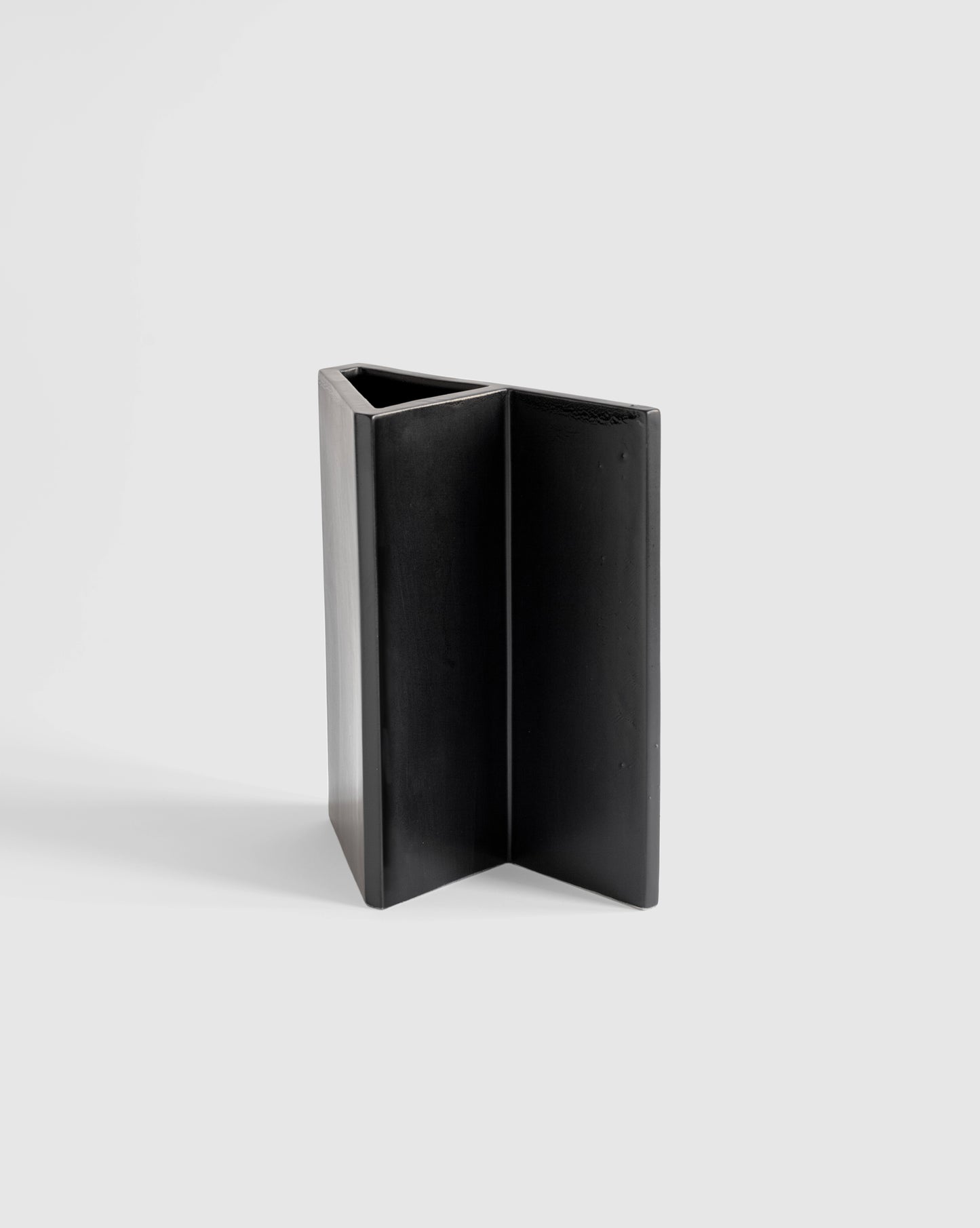 Handcrafted matte black Knight Vase, showcasing a bold brutalist design.