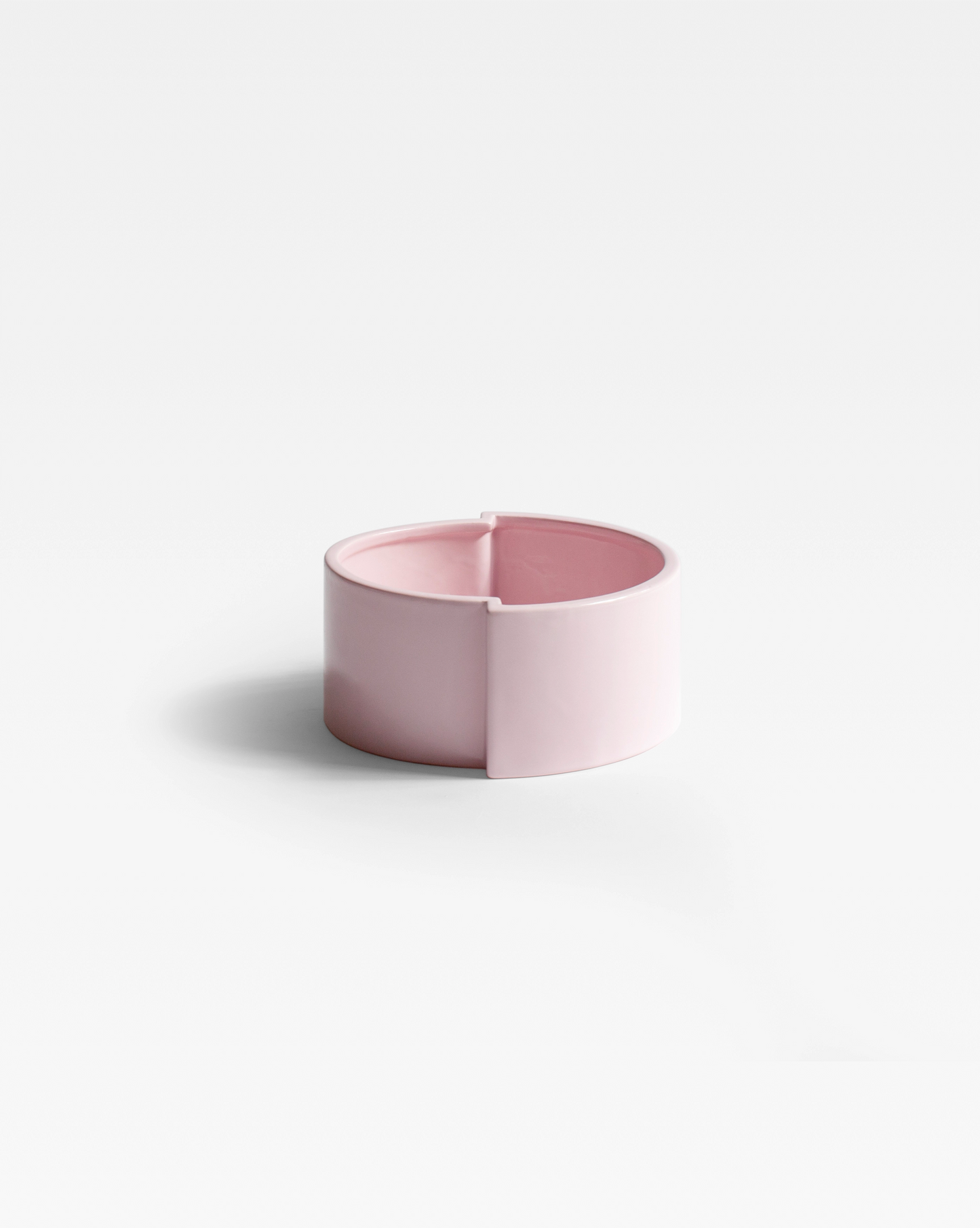 The handmade ceramic Pink Pawn Fruit Bowl as a centerpiece, adding a bold pop of color to contemporary interiors.
