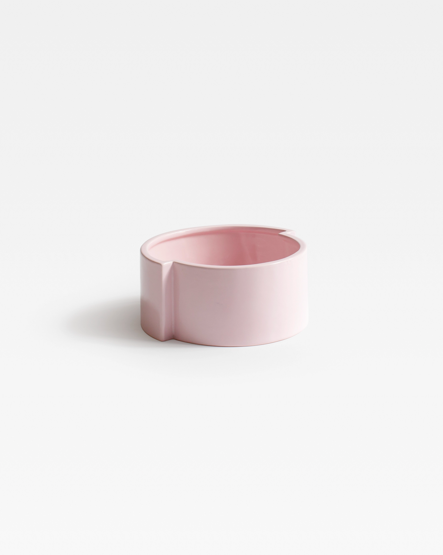 The playful pop Pink Pawn Fruit Bowl, highlighting its sleek, minimalist design in a vibrant pink ceramic finish.