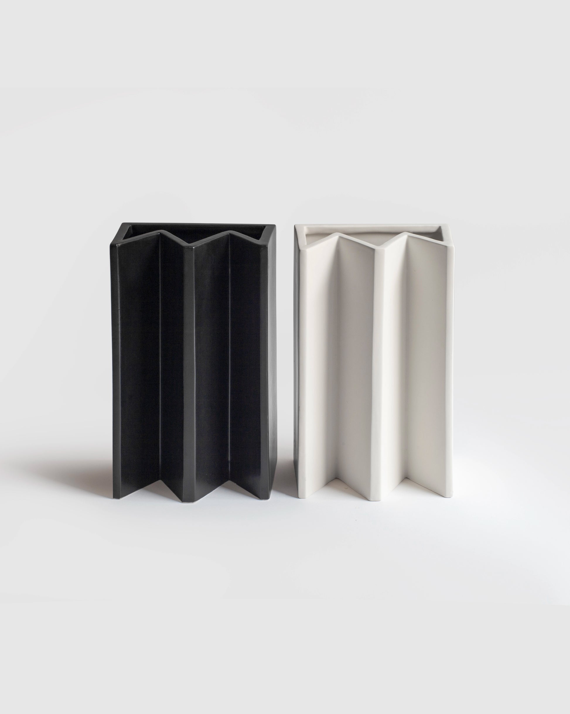 Handcrafted matte white and black King Vases, showcasing elegant design.