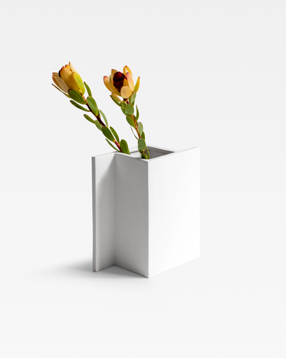 The chess-inspired white Rook Vase with a matte white finish perfect for contemporary interiors.