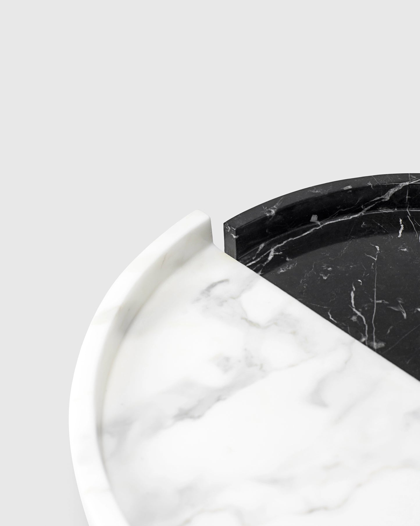 detail shot of the Elegant "Mistake" tray made from Nero Marquina and Statuario marbles, with a gap