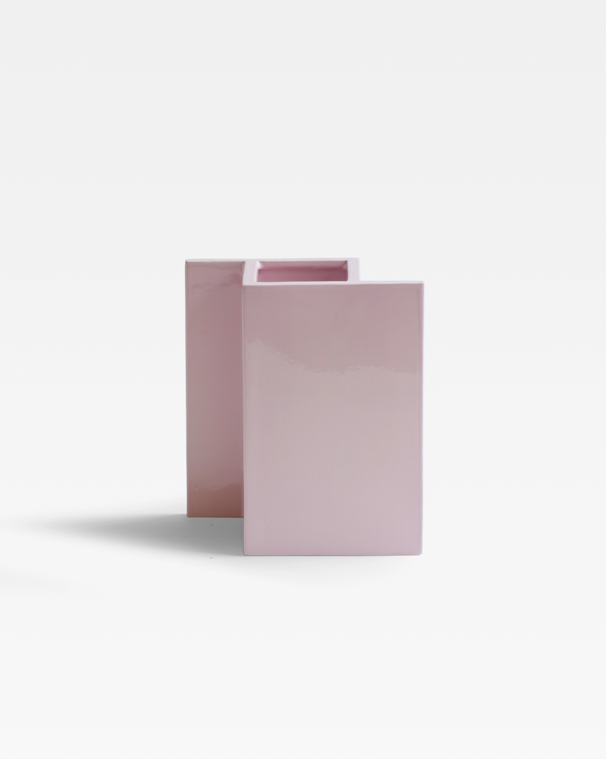 The Rook Vase with a modern and minimalist ceramic design in a pop pink glaze.