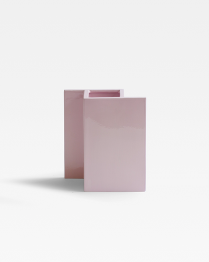 The Rook Vase with a modern and minimalist ceramic design in a pop pink glaze.