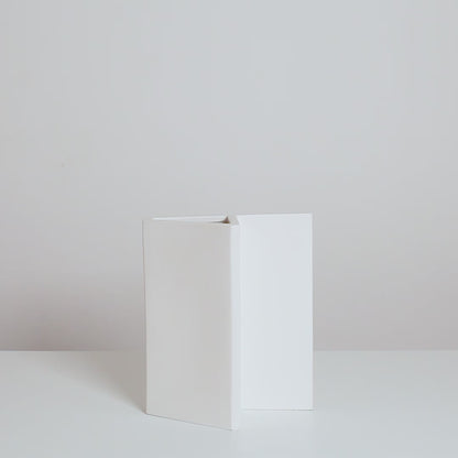 Video of a minimalistic white handmade ceramic vase by Sandro Lopez Milano.