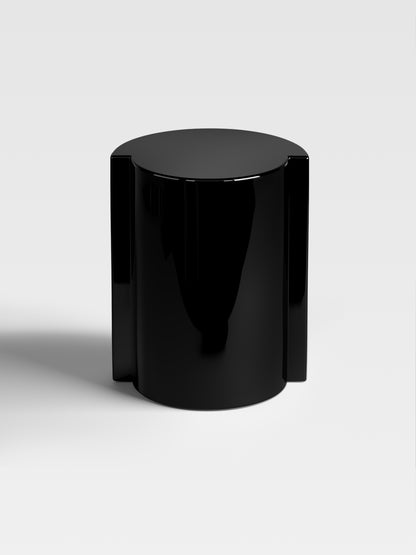 Lei side table in deep black lacquer, handcrafted in Italy — sculptural minimalist furniture for luxury interior design settings.