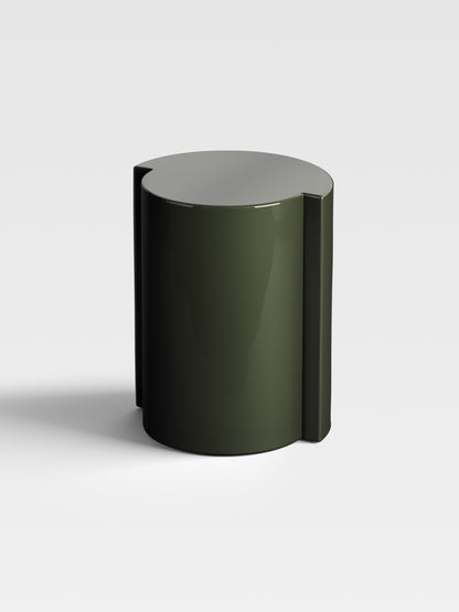 Angled view of Lei olive side table showing sculptural curvature and elegant high-gloss finish made in Milan.