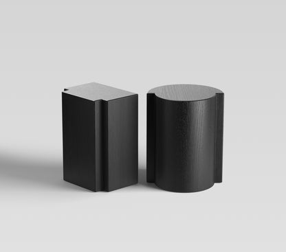 Lei and Lui black oak side tables, artistic collectible furniture with tactile depth and luxury presence for contemporary interiors.
