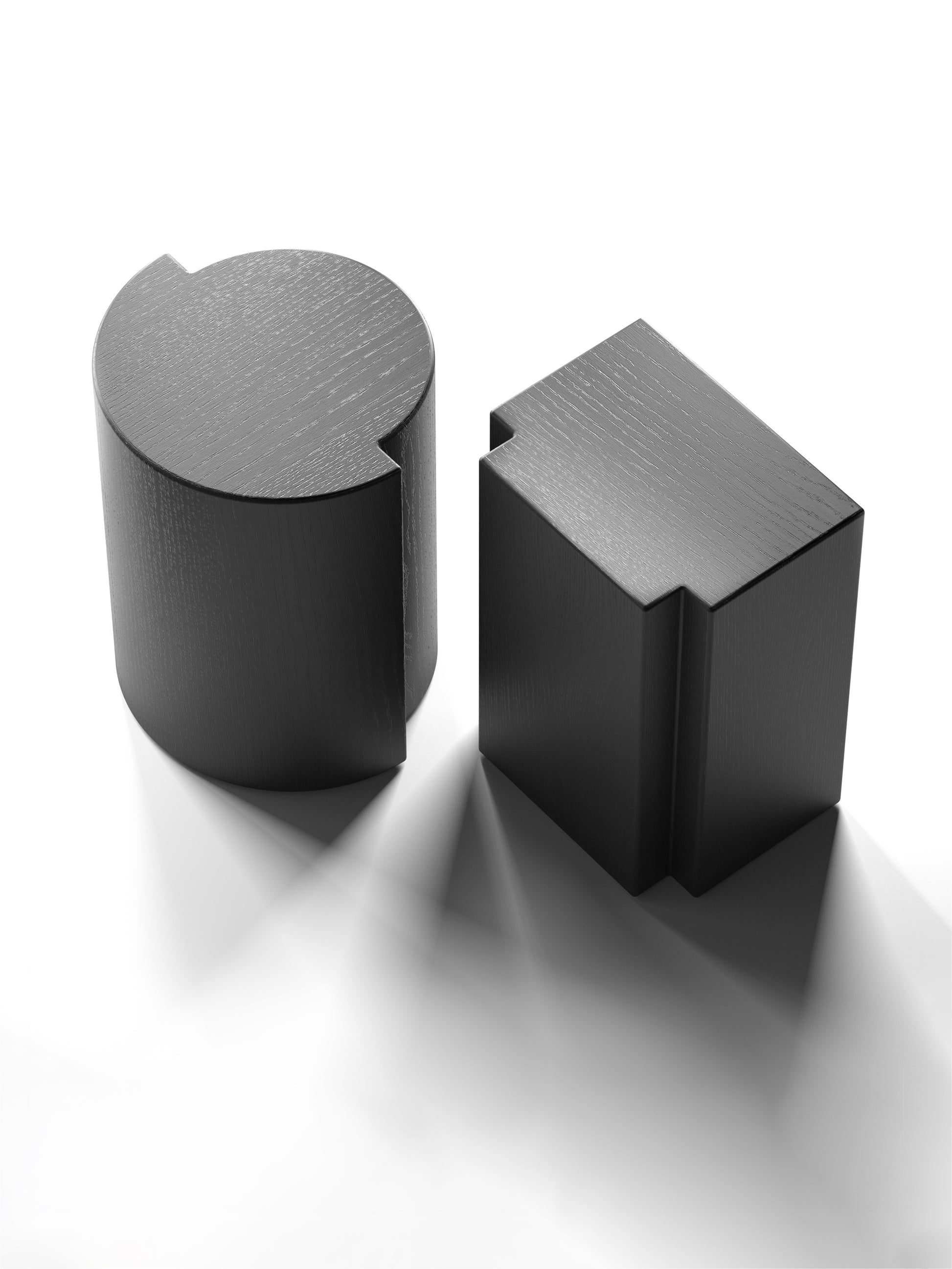 Lui and Lei sculptural oak stools and side tables in black, handcrafted to order in milan