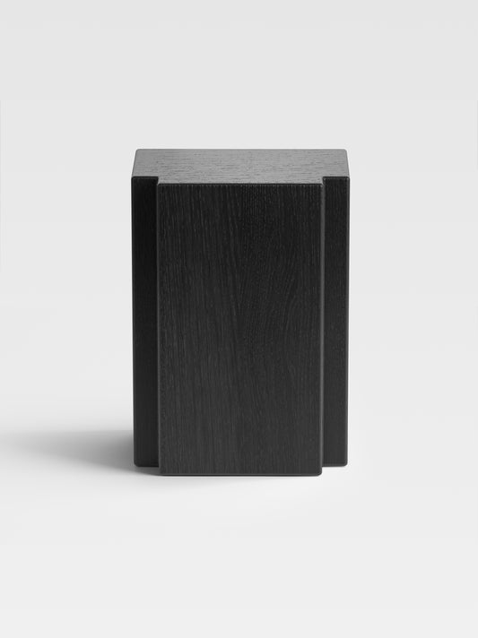 Lui side table in black-stained oak, handcrafted in Italy — sculptural modern furniture with tactile wood texture for luxury interiors.