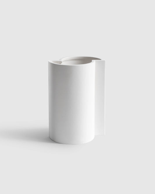 Minimalist white Bishop Vase with a matte finish and deconstructionst design.